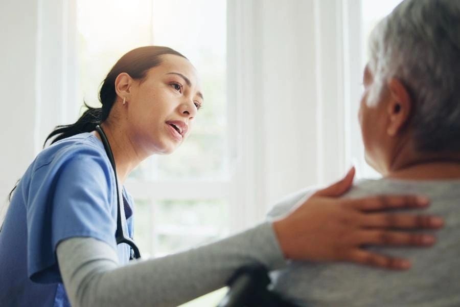 Home care professional assisting a veteran